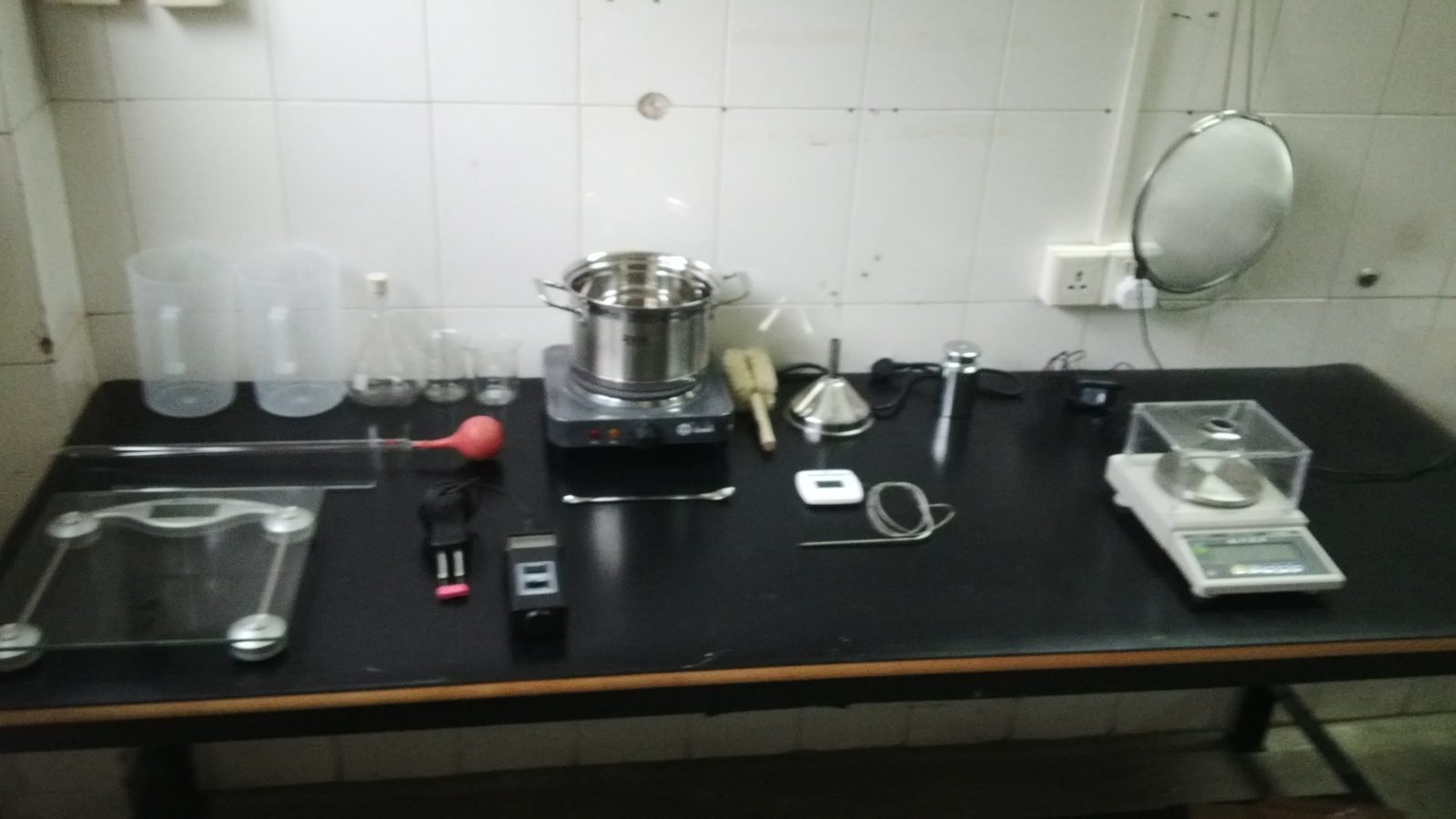 Laboratory bench with scales and glassware used for fuel quality checks